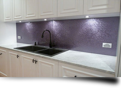 A new toughened glass kitchen splashback giving an old kitchen a makeover