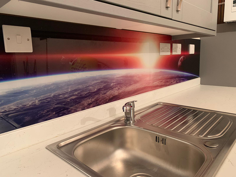 Glass splashback with space scape
