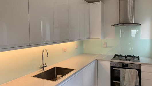 Glass white kitchen splashback