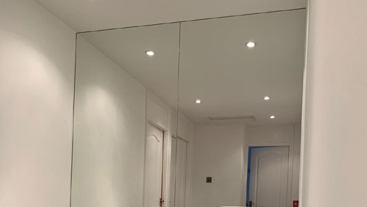 Silver mirror in a hallway